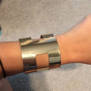 Gold cuff bracelet with cutouts